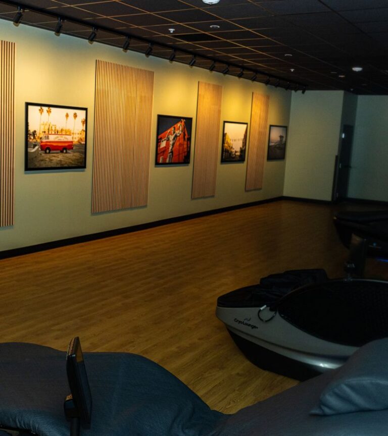 Massage chair recovery room at Gold’s Gym Arvada with premium loungers and calm lighting.