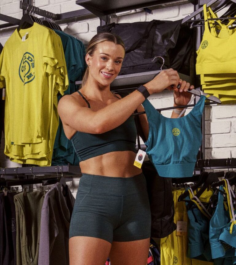 Member browsing Gold's Gym branded workout apparel in the pro shop at Gold's Gym Greeley