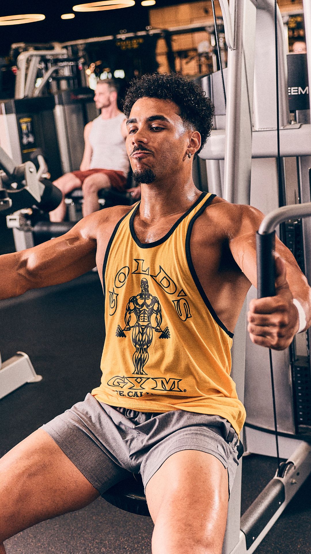 Member training on a chest fly machine at Gold’s Gym Longmont in the strength equipment area