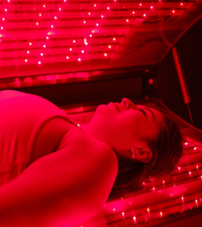 Member using red light therapy for recovery at Gold's Gym Longmont