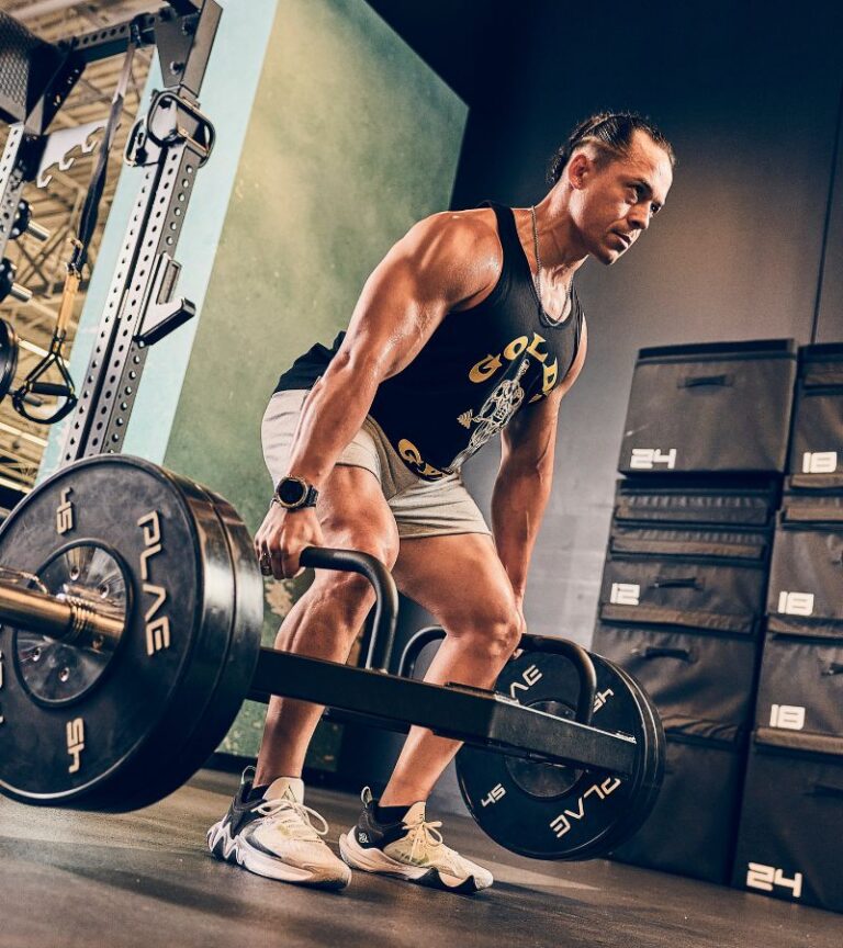 Member strength training with free weights and lifting equipment at Gold’s Gym Colorado.