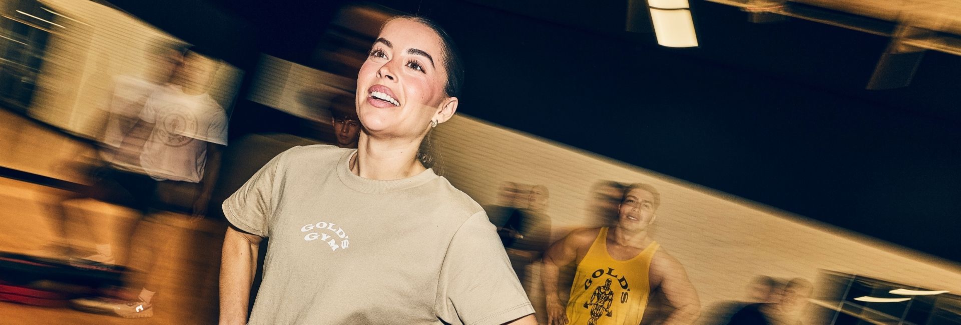 Gold’s Gym Colorado members participating in a high-energy HIIT group fitness class.